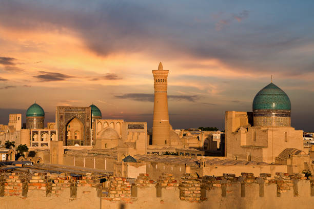 Poi Kalon Mosque and Minaret, in Bukhara, Uzbekistan. View over the Poi Kalon Mosque and Minaret at the sunset, in Bukhara, Uzbekistan. bukhara stock pictures, royalty-free photos & images