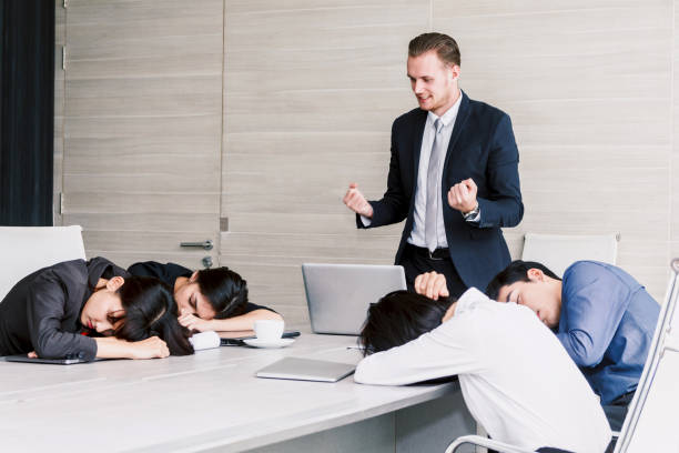 Group of business people sleeping at the meeting stock photo