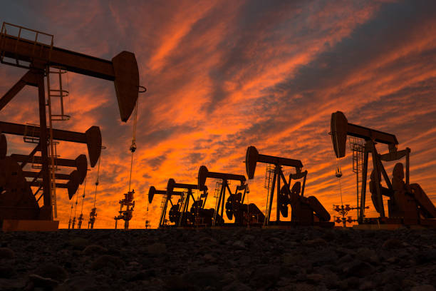pump jacks in an oil field stock photo