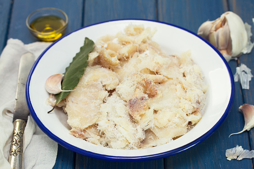salted codfish with bay leaf on dish