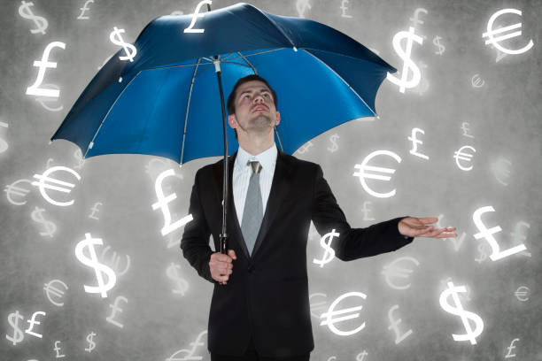 istock businessman under the rain currencies 914876384