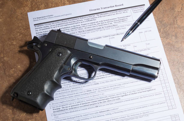 Pistol with the paperwork to transfer the gun