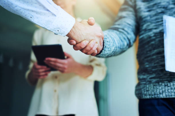 istock Partnering together to take over the business world 914876934