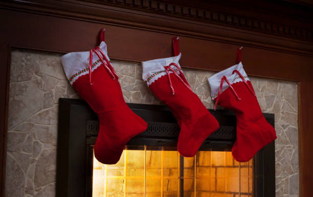 istock Three Christmas stockings over the fireplace 914876974