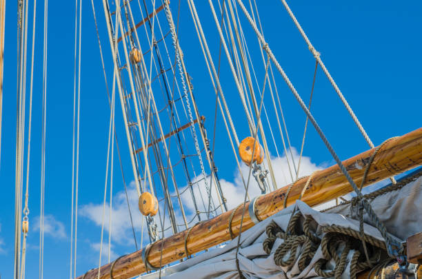 istock Folded sail and mast on an old sailboat 914882550