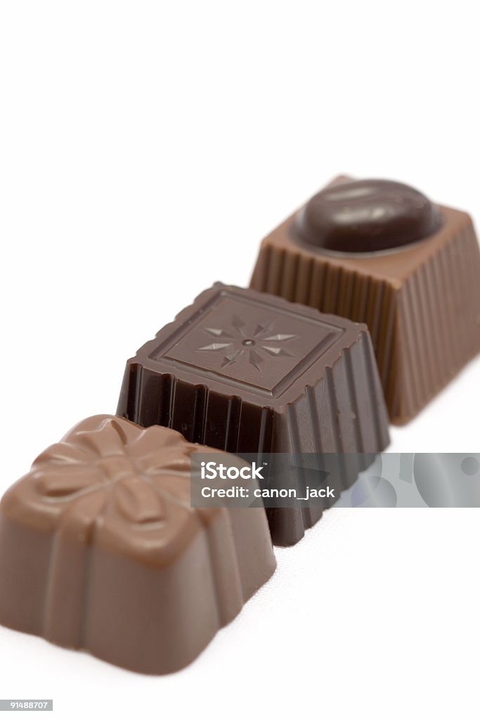 Tre cioccolato bon cioccolatini in una riga - Foto stock royalty-free di Amore