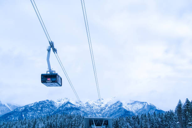 Black and white photo of a ski lift in the winter