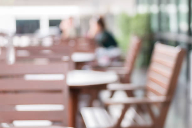 istock Blurred background restaurant interior blank table and chair and people sitting in restaurant or cafe 914891396