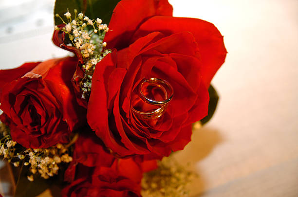 Wedding Bands and Bridal Bouquet stock photo
