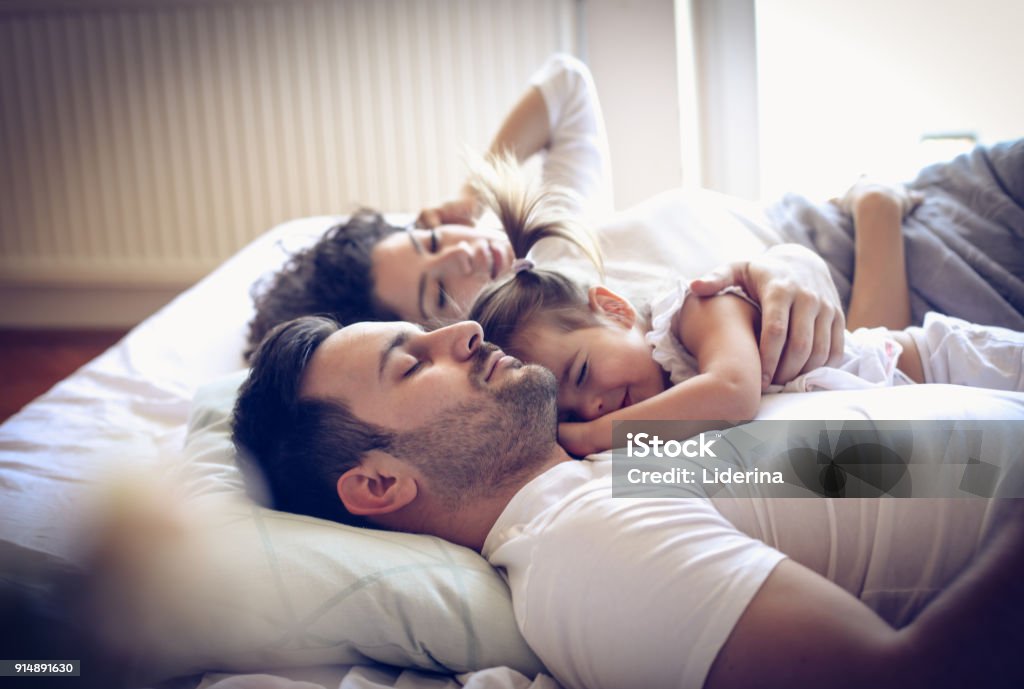 Happy sleepy family. Sleeping Stock Photo