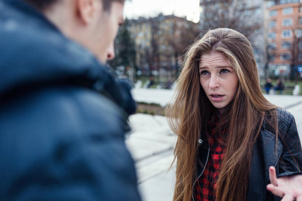 istock Young couple having a quarrel on the street 914891726