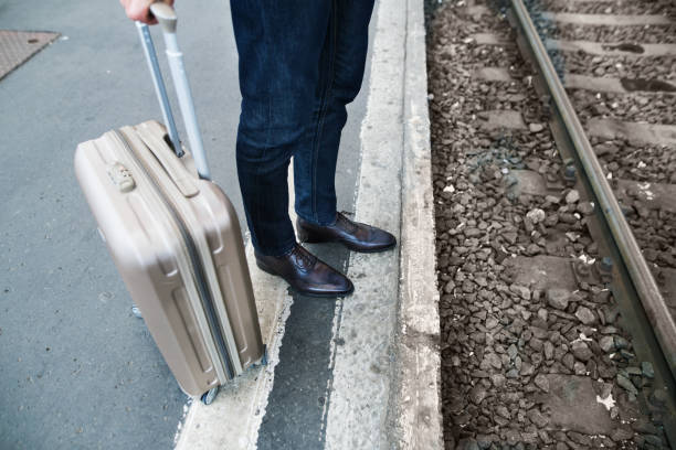 istock Mature businessman on a train station. 914892200
