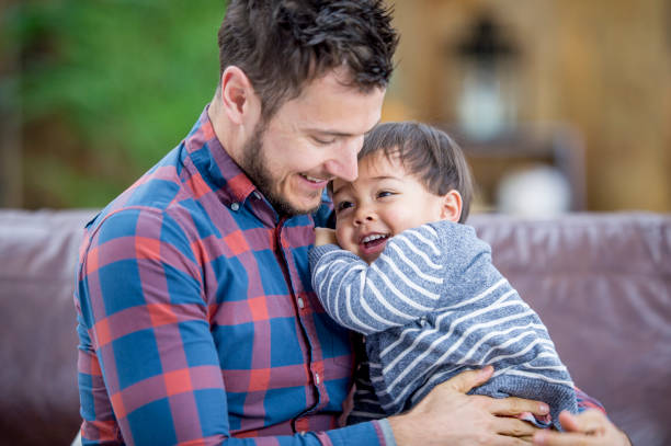 istock Father Tickling His Son 914892360