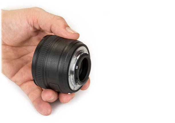 istock Zoom and fix lenses on camera on the white background 914895768