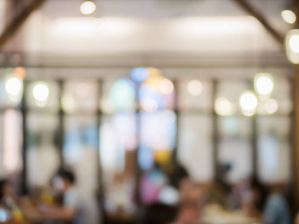 istock Customer at restaurant blur background with bokeh. restaurant background blur cafe shop coffee food bokeh blurry menu lifestyle window business light interior crowd dinner table 914895962