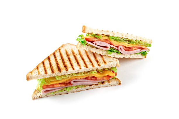 istock Sandwich with ham, cheese, tomatoes, lettuce, and toasted bread. Isolated on white background. 914899576