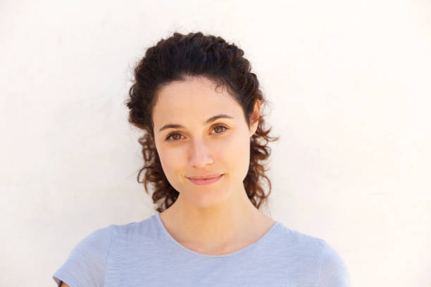 istock Close up attractive young woman against white wall 914901348
