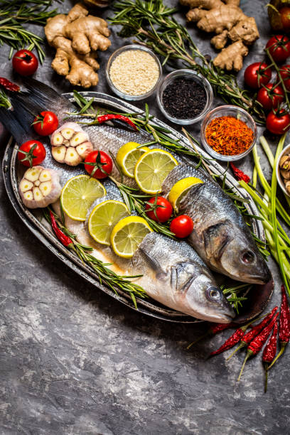 istock Fish, sea bass and ingredients for cooking 914906010