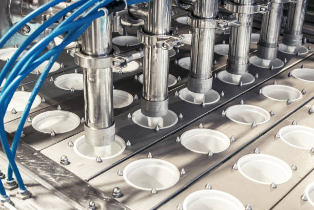 istock unit for pouring yogurt into plastic jars at a dairy factory 914909874