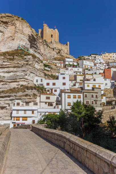 istock Roman bridge leading to Alcala del Jucar, Spain 914913548