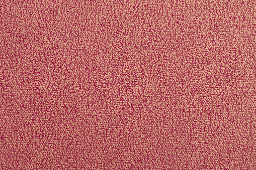 Ruby-red paper background with painted golden pattern