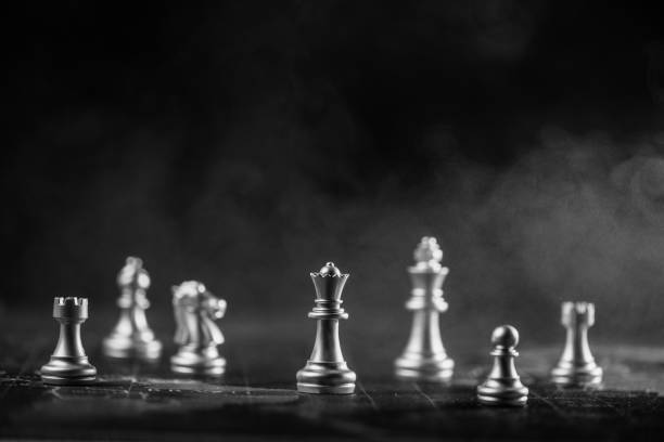 istock silver chess on world map with smoke background illustrate strategy and business concept 914921458