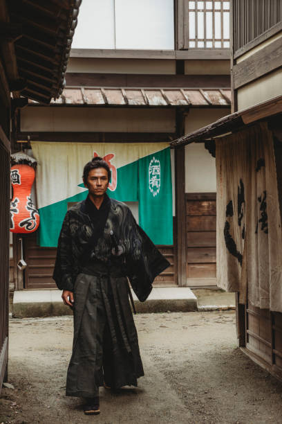 istock Samurai walking in a traditional japanese village 914924924