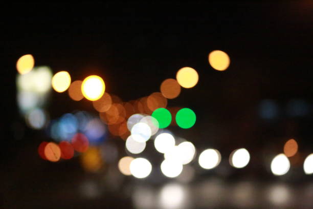 istock Light bokeh and traffic at nighttime abstract background 914929262