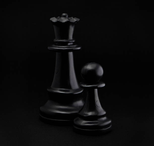 istock Chess. Black Pawn and Queen. 914929636