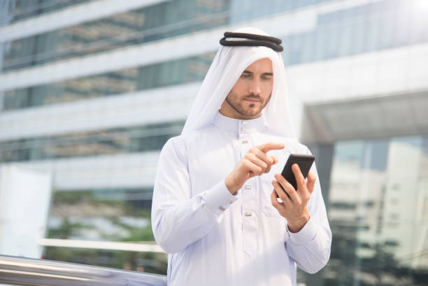 istock businessman arabic hand using mobile phone. concept communication. 914932844
