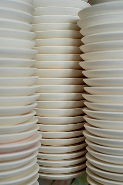 istock Set of white dishes isolated on white.Stack of plates 914933740