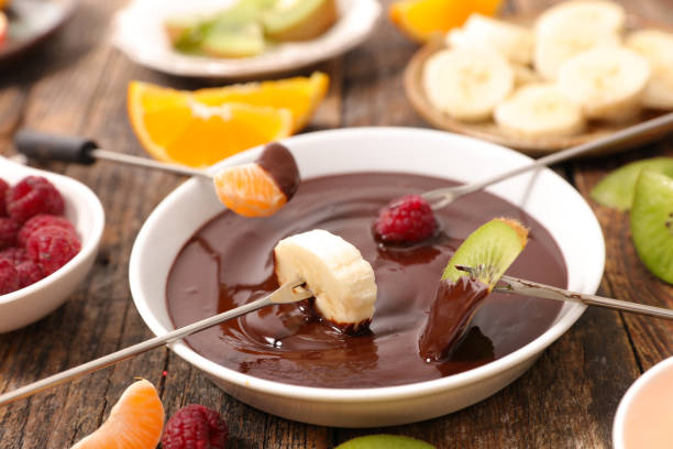 istock chocolate fondue with fruits 914940728