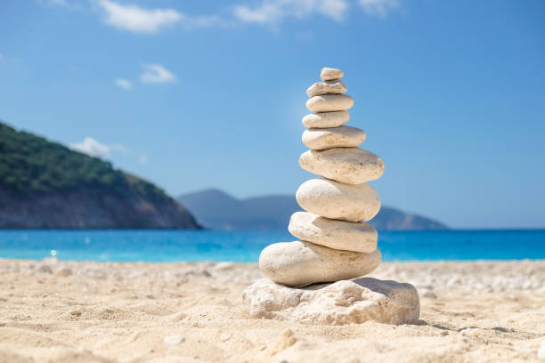istock Balancing several of stones on the seashore beach 914941054