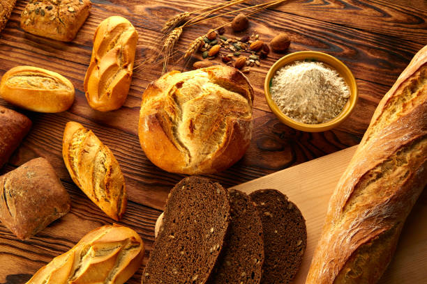 istock Bread varied mix on golden aged wood table 914941288