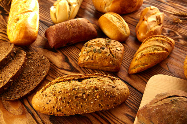 istock Bread varied mix on golden aged wood table 914941332