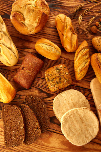 istock Bread varied mix on golden aged wood table 914941398