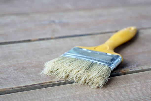 istock Paint brush on the wooden floor 914944184