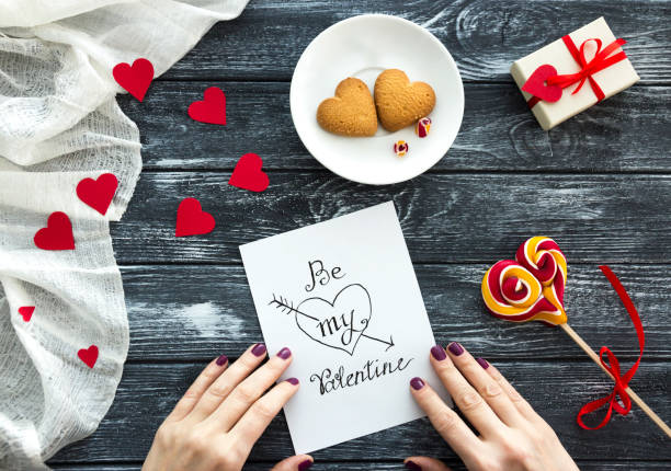istock Female hands touched a Love Letter for Valentines Day 914944464
