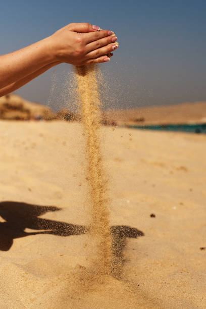 istock let the sand in the wind 914945426