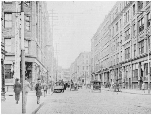Antique photograph of Boston, Massachusetts, USA: South Street Antique photograph of Boston, Massachusetts, USA: South Street monochrome photos stock illustrations