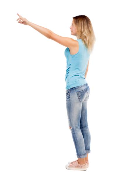 istock Back view of  pointing woman. 914953218