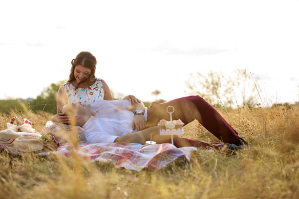 istock Loving couple enjoying picnic in nature 914953298