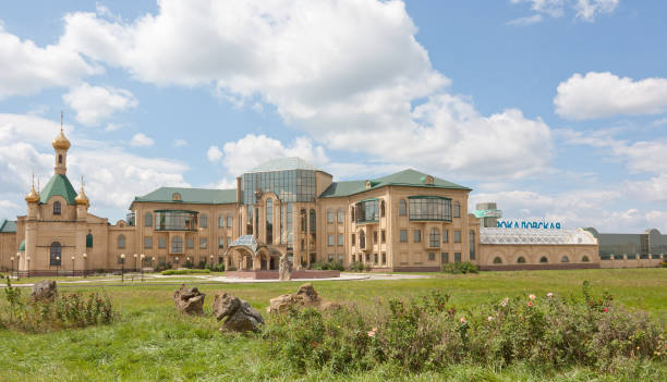 Summer landscape. The factory building and the church Stavropol, Russia-5 August, 2013: Plant for bottling of mineral water and soft drinks JSC "Rokadovskie mineral water" stavropol stavropol krai stock pictures, royalty-free photos & images