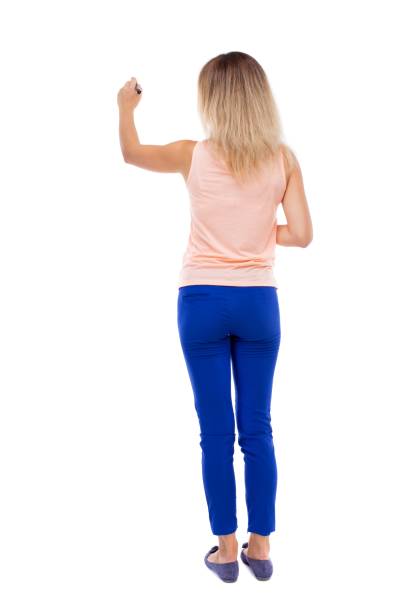 istock back view of writing beautiful woman. 914956064