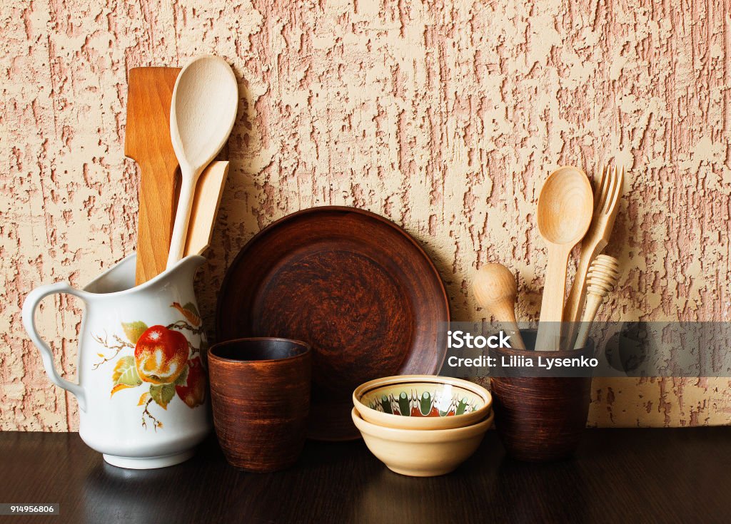 Kitchen Utensils And Dishware On Dark Table Over Beige Background Kitchen  Interior Background Stock Photo - Download Image Now - iStock