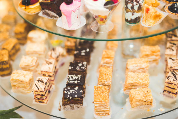 istock Delicious sweets on wedding candy buffet with desserts, cupcakes 914959784