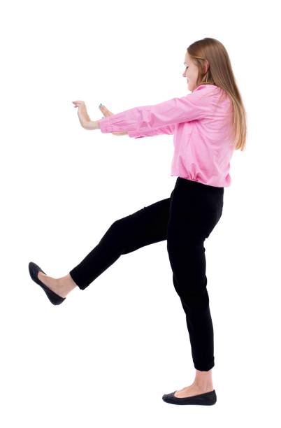 istock back view of business woman pushes wall. 914960106