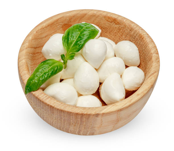 istock Mozzarella cheese and basil in bowl on white background 914960884