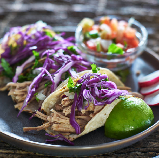 istock mexican carnitas street tacos with cilantro and red cabbage 914960926