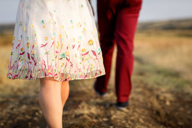 istock Loving couple in summer meadow 914965302